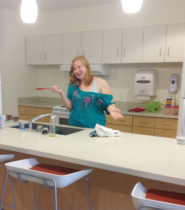 Junior Aileen Zietlow, a Resident Assistant for the building complex, in the kitchen of 63 Beech.