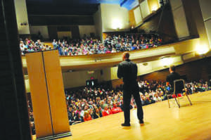 Maynard speaks to the crowd in Gamble Auditorium.