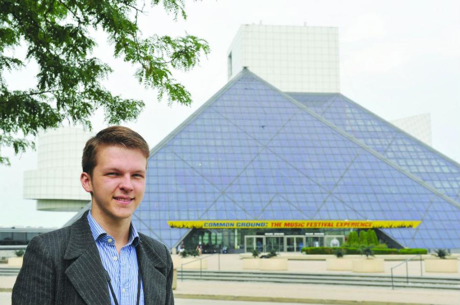 Senior Nicholas Wilders stands in front of the Rock and Roll Hall of Fame in Cleveland.