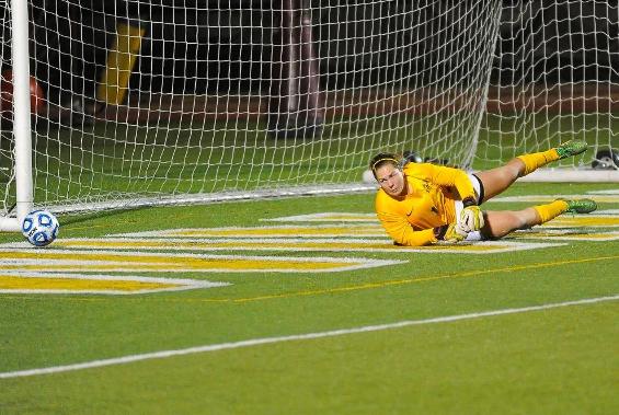 Junior Goalkeeper Emily Tallmadge makes a save against Case Western. She finished the game with ten saves.
