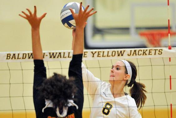 Baldwin Wallace University Freshman Volleyball player Melissa Metz goes up for a hit against Wilmington. 