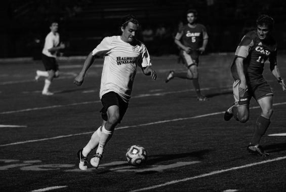 Senior Academic All-OAC midfielder Michael Brennan brings the ball down the field in BW’s s victory against Capital University on their home Tressel Field inside The George Finnie Stadium. 
