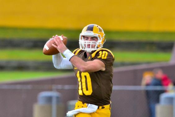 Junior Quarterback Tyler Moeglin accounted for five touchdowns and scored three separate ways as the Baldwin Wallace University football team defeated rival Capital University, 48-14, at Bernlohr Stadium. 