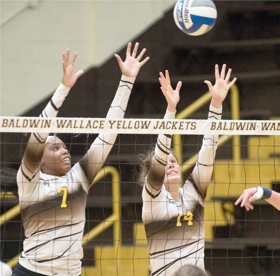 Taylor Brown, left, and Alicia Lortcher registered assisted blocks as the team swept Ohio Northern University last week.