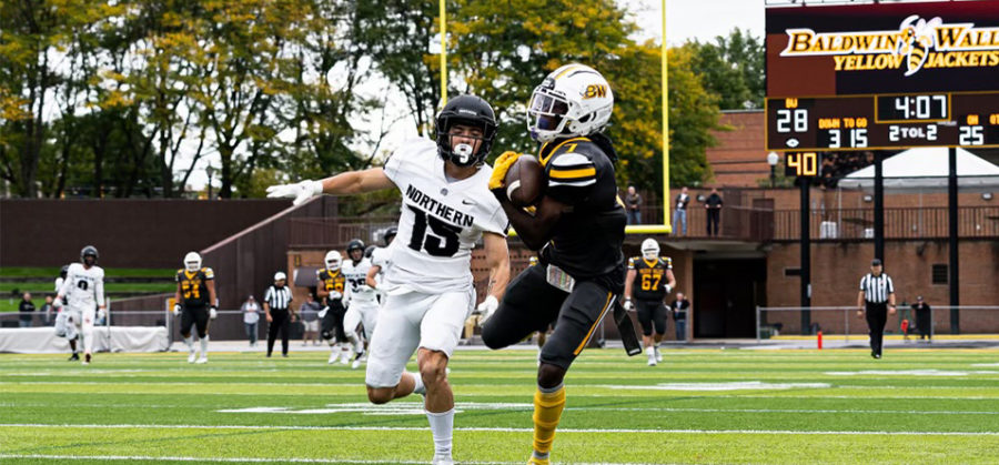Senior+wide+receiver+Darius+Stokes+hauls+in+the+games+winning+score%2C+a+75-yard+touchdown+pass+thrown+by+junior+Joey+Marousek.+Photo+courtesy+of+University+Relations