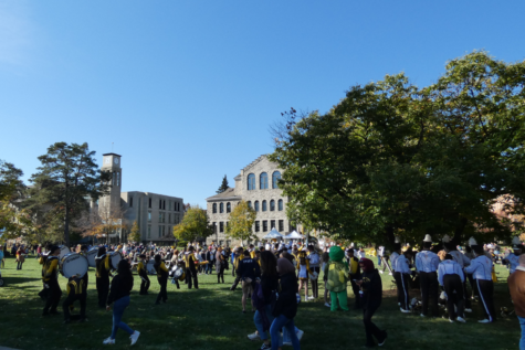Members of the BW Marching Band prepare for a performance on north campus during BWs Bold & Gold Homecoming Festival.