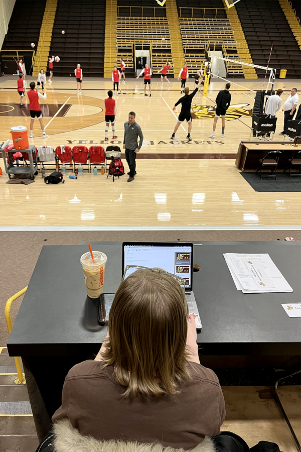 Alyssa Klauminzer, Athletic Communications student assistant, gets ready for a volleyball tournament taking place at BW.