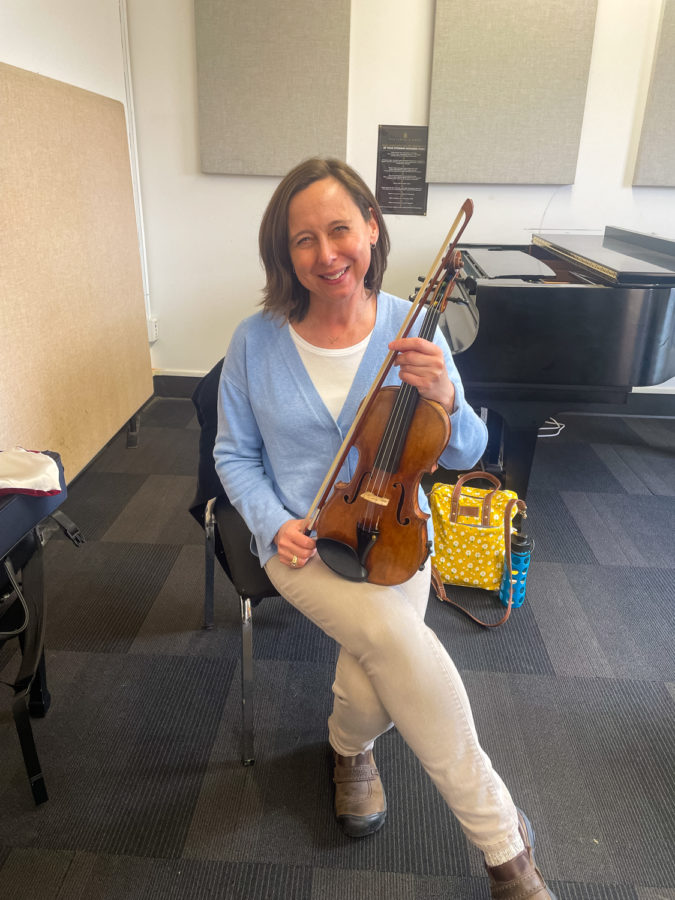 Carol+Ross+in+a+classroom+in+Kulas+on+April+6%2C+2023%2C+waiting+for+her+next+student+to+arrive.+She+is+a+member+of+the+BW+Community+Arts+School+faculty%2C+teaching+violin+and+viola+private+lessons+and+the+Suzuki+Program.