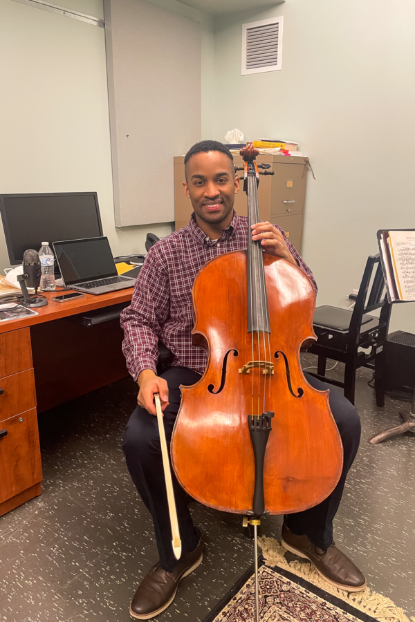 BW music professor holding cello