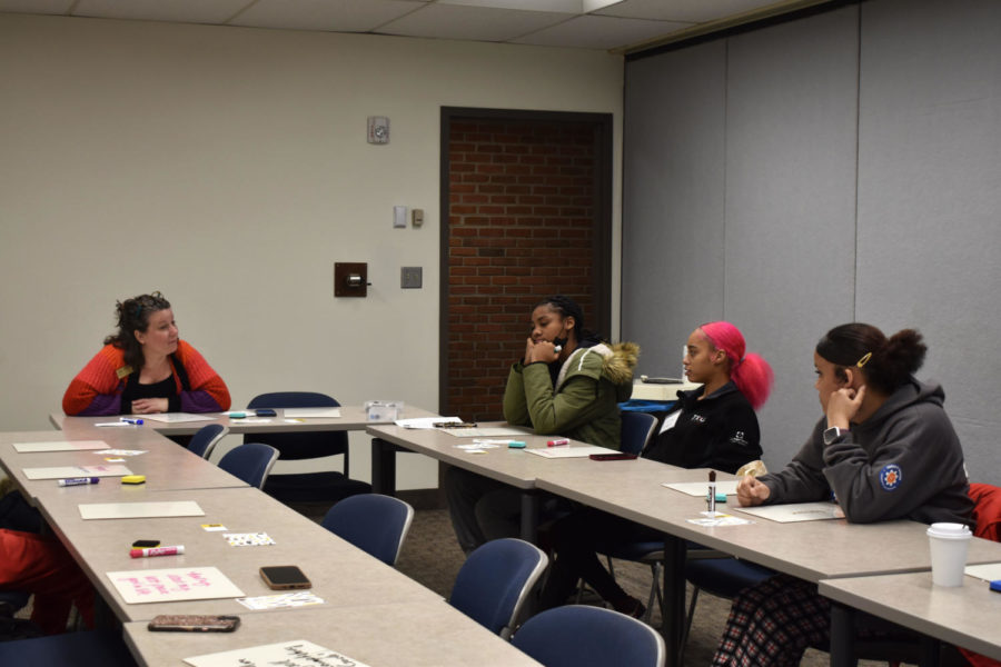 Claudine Grunenwald Kirschner (left) leads a workshop for seniors who are preparing for college.
