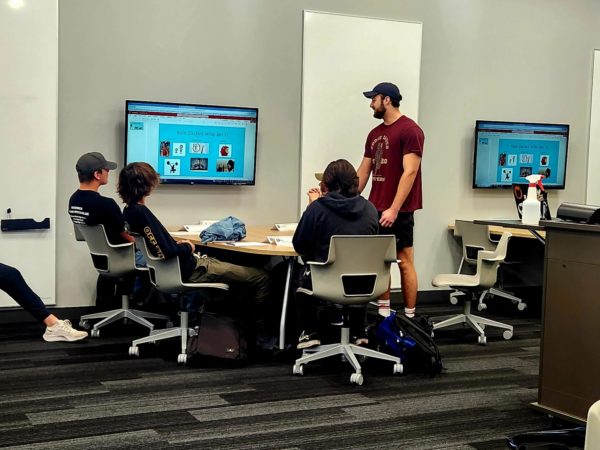 Sam Zachel presents his “Who am I?” presentation to his First Year Experience class taught by Catherine Lane, professor of mathematics, in the Knowlton Center. Students were tasked to create a slide to present their hobbies, background and fun facts.