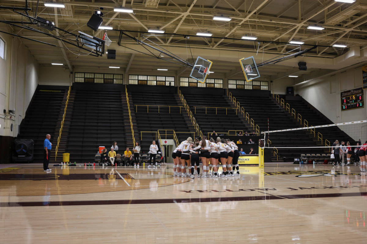 The BW Volleyball team huddles before their game against Muskingum University. 