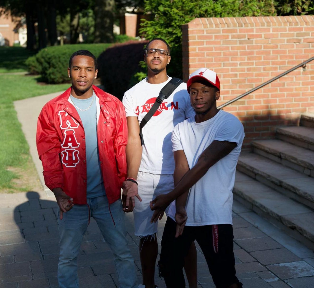 Left to right: Fraternity brothers Desmond Manley, Nick Welch and DeArie Brown in front of the Union.