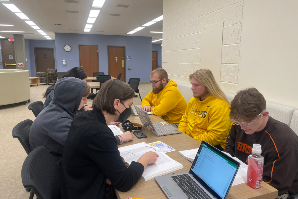 Students study for psychology with the help of Megan Garriga, the director of CASA on Thursday. 