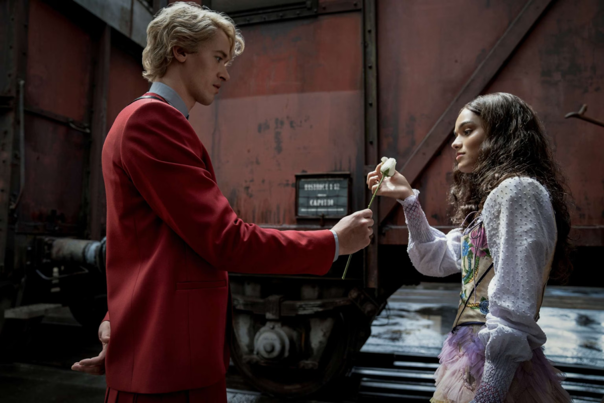 Coriolanus Snow, played by Tom Blyth, and Rachel Zegler, played by Lucy Gray Baird in a scene from The Hunger Games: The Ballad of Songbirds and Snakes.  