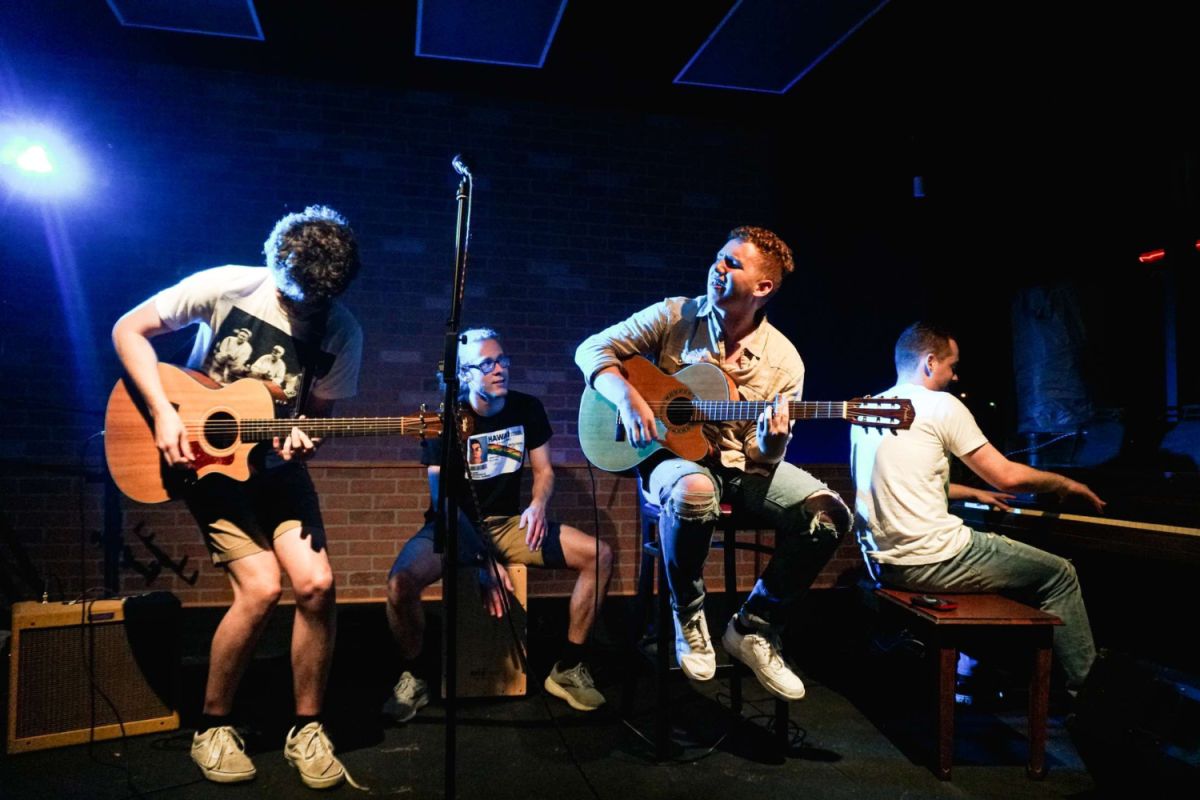 (Left to right): Student performers Jack Lutz, Aidan Schaffer, Hank Temple and Gideon Temple perform their music at The Local Bar on June 23. 