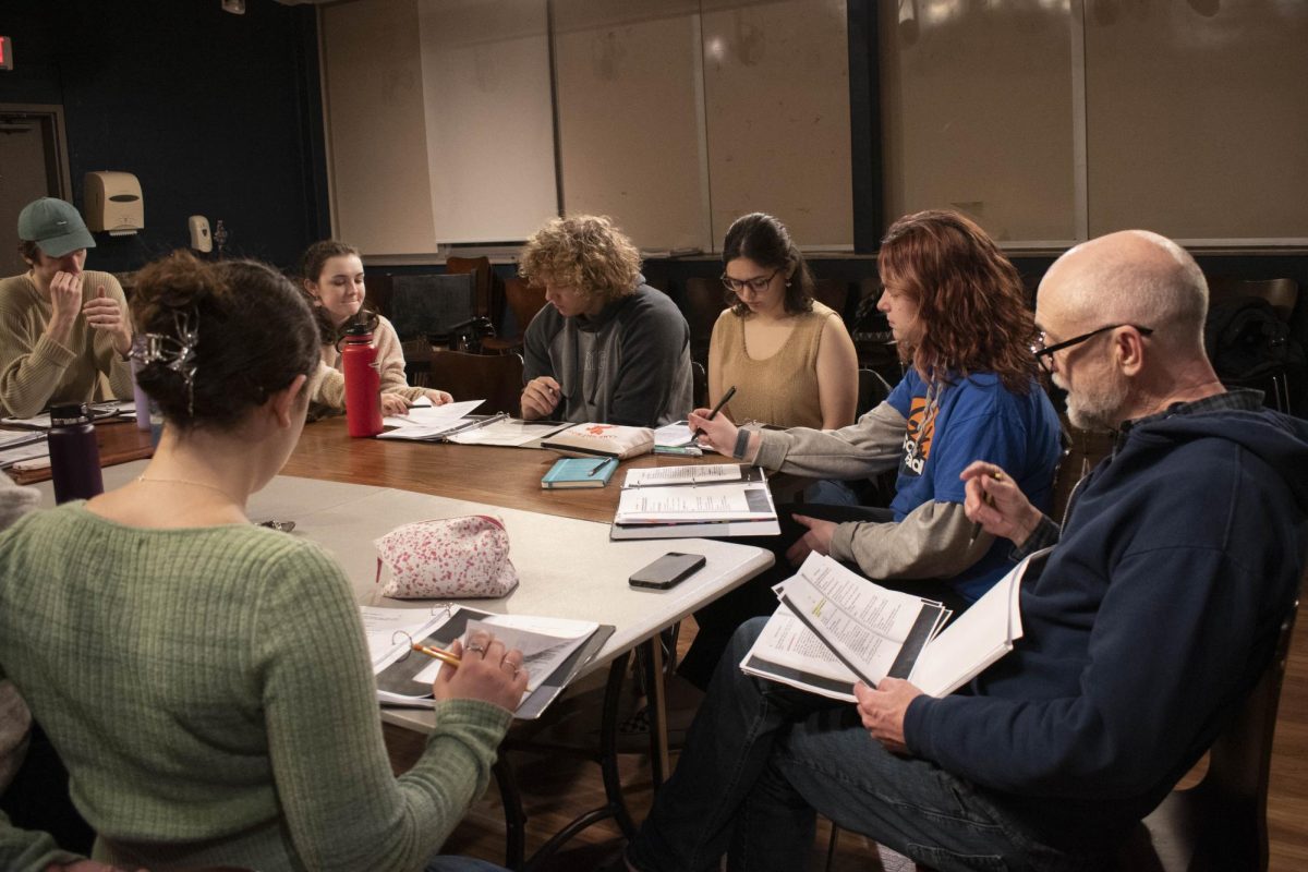 Director David Alford breaks down a scene for the cast of Beyond Therapy during their rehearsals.