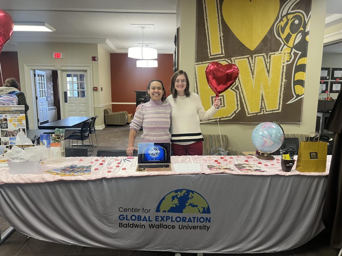 Left to right: Gaby Rolim Da Silva Figuero and Hallie Vavrus working the Center for Global Exploration’s I Heart Travel Day booth in the Student Union.