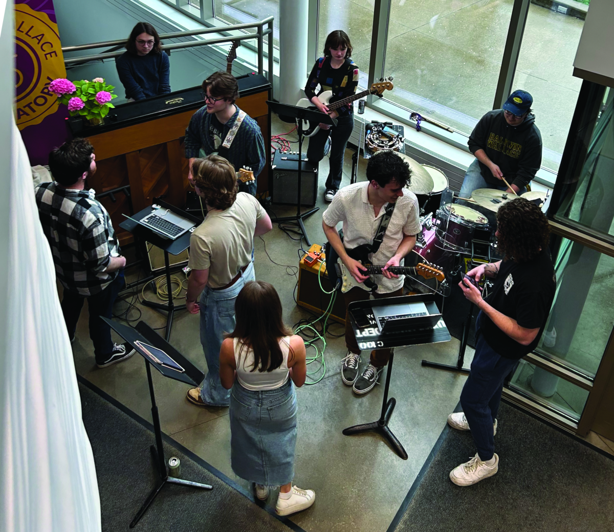 The BW Beatles play their songs in the lobby of the Boesel Musical Arts Center. 