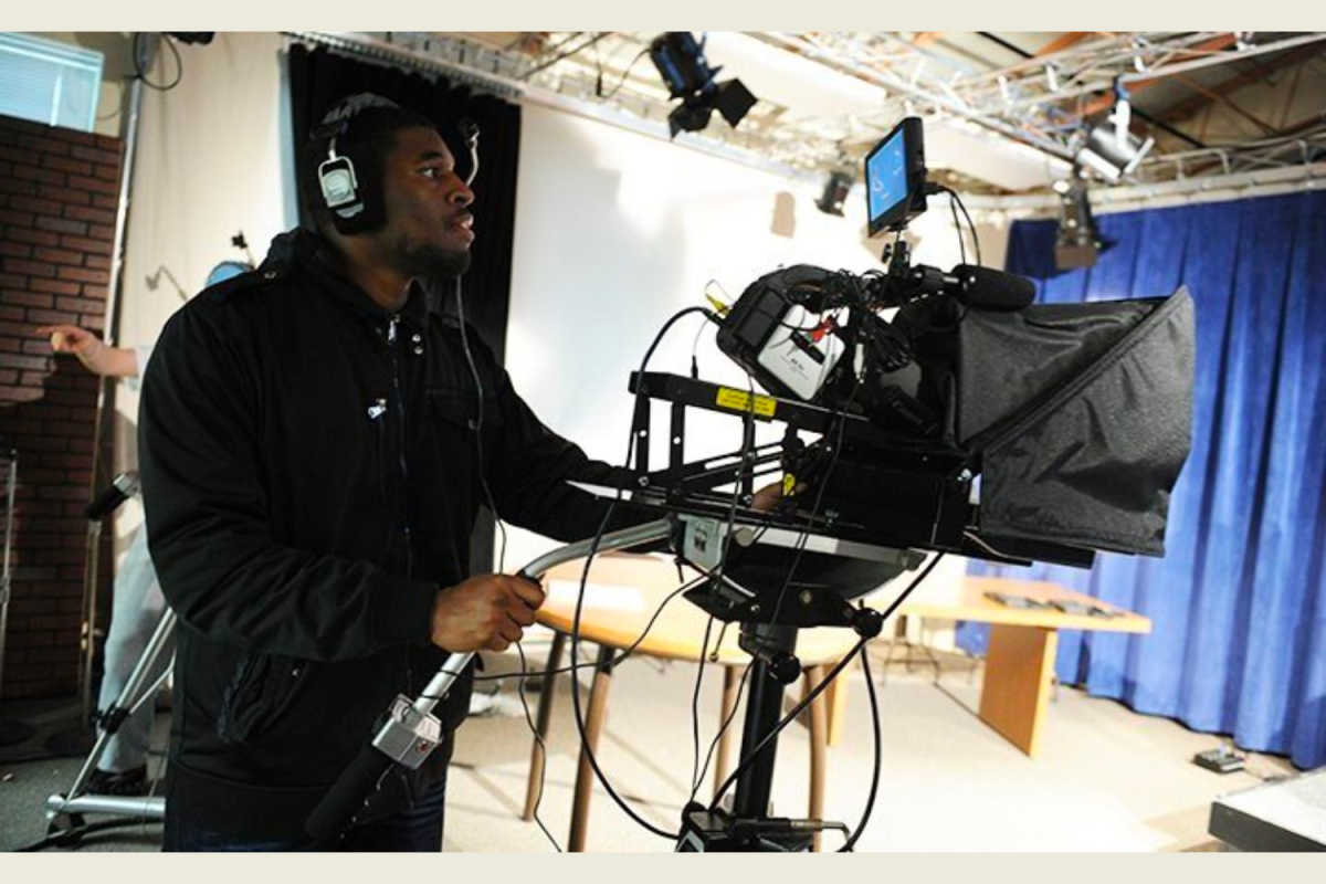 A photo of a student capturing production footage.