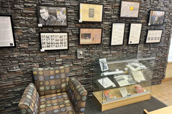 A chair sits beside the Reverend James Lawson exhibit at Ritter Library, offering visitors a place to pause and explore his legacy. 