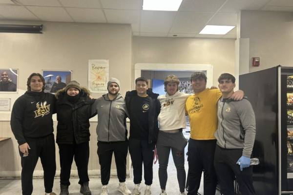 (left to right) Football teammates at the Lakeside Men’s Emergency Shelter: Zach Cuglewski, RJ Pegues, Dominic Biagiotti, Josiah Sessler, Caden Potts, Colton Ross and Jacob Reed.