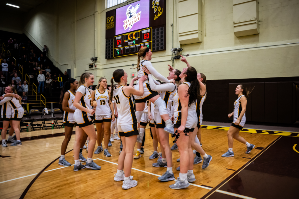 The Yellow Jackets celebrate together after winning the OAC Championship, exemplifying the team’s purpose statement: “Whatever it takes for each other.”