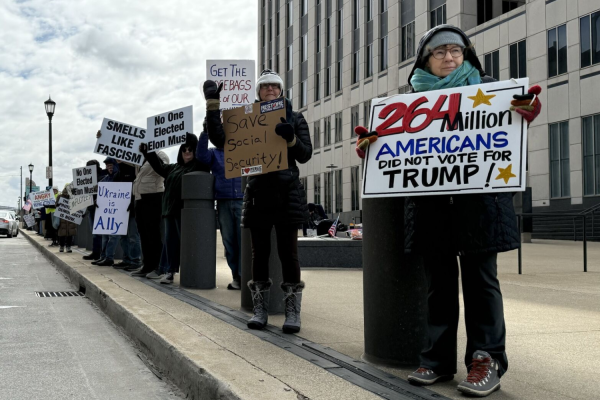 Protestors from Mobilize the Vote NEO gather in front of Ohio Senator Bernie Moreno’s office in downtown Cleveland. 