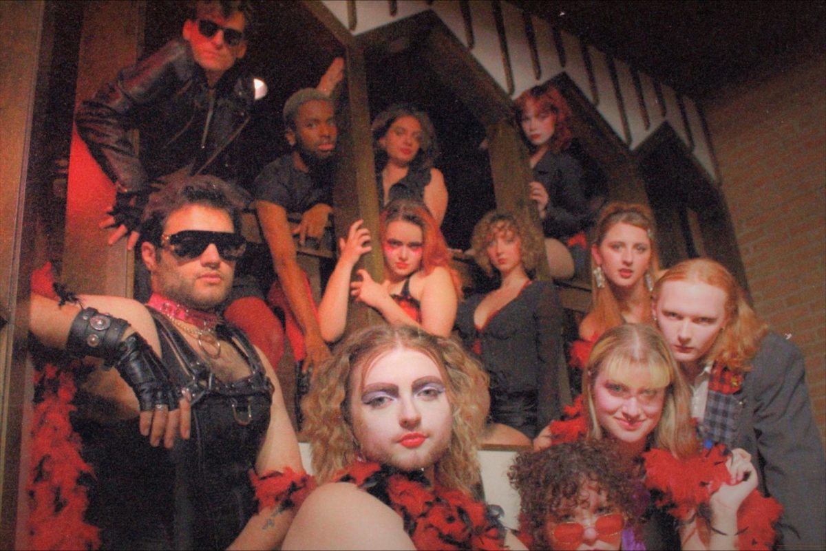 Cast of Rocky Horror poses in costume.