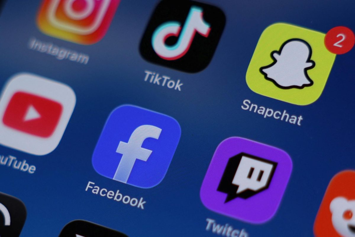 Instagram, TikTok, Snapchat, YouTube, Facebook, Twitch and Reddit applications are displayed on a mobile phone in this picture illustration taken on December 9, 2025. REUTERS/Hollie Adams/Illustration
